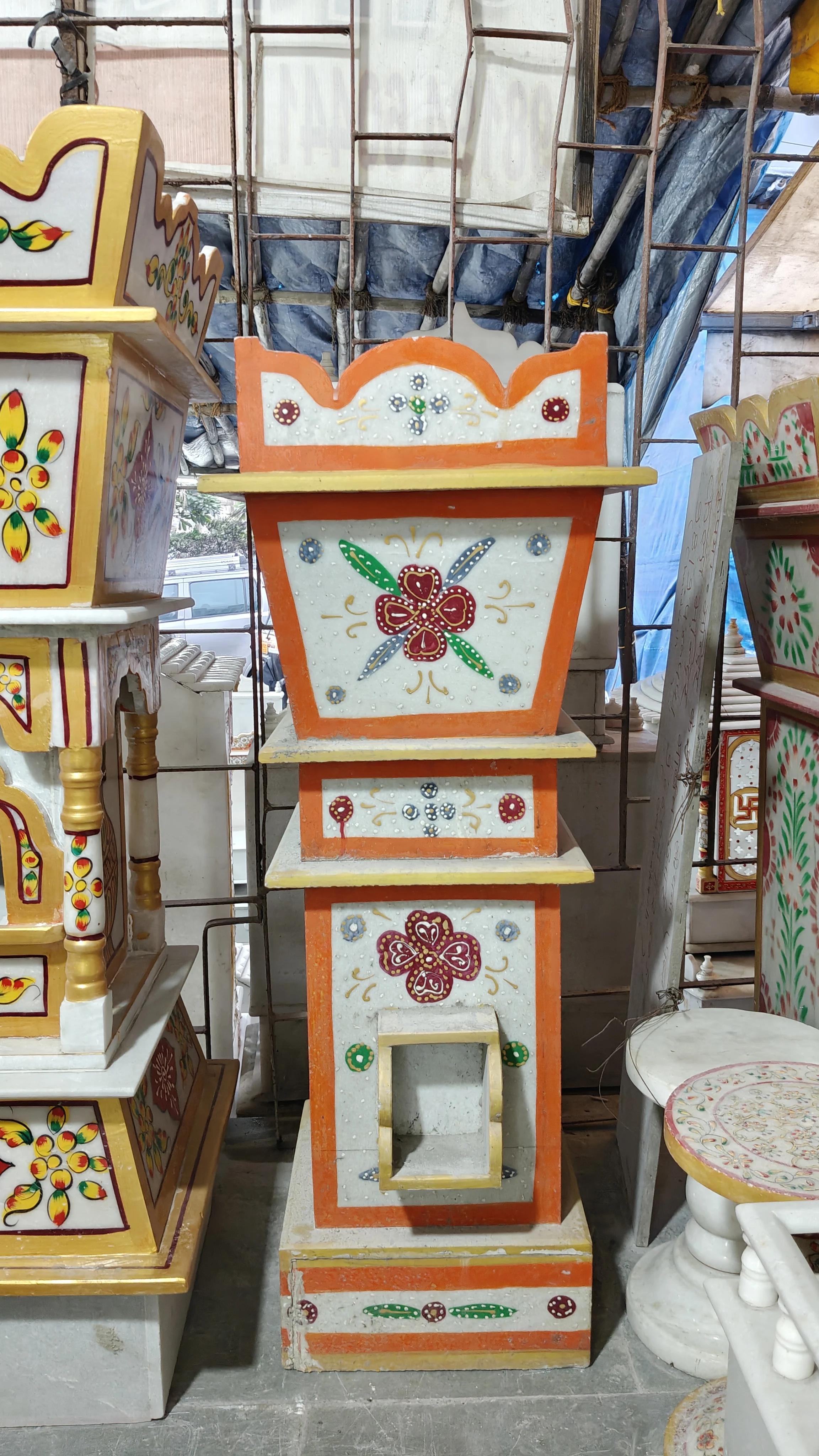 Marble tulsi stand with floral engravings