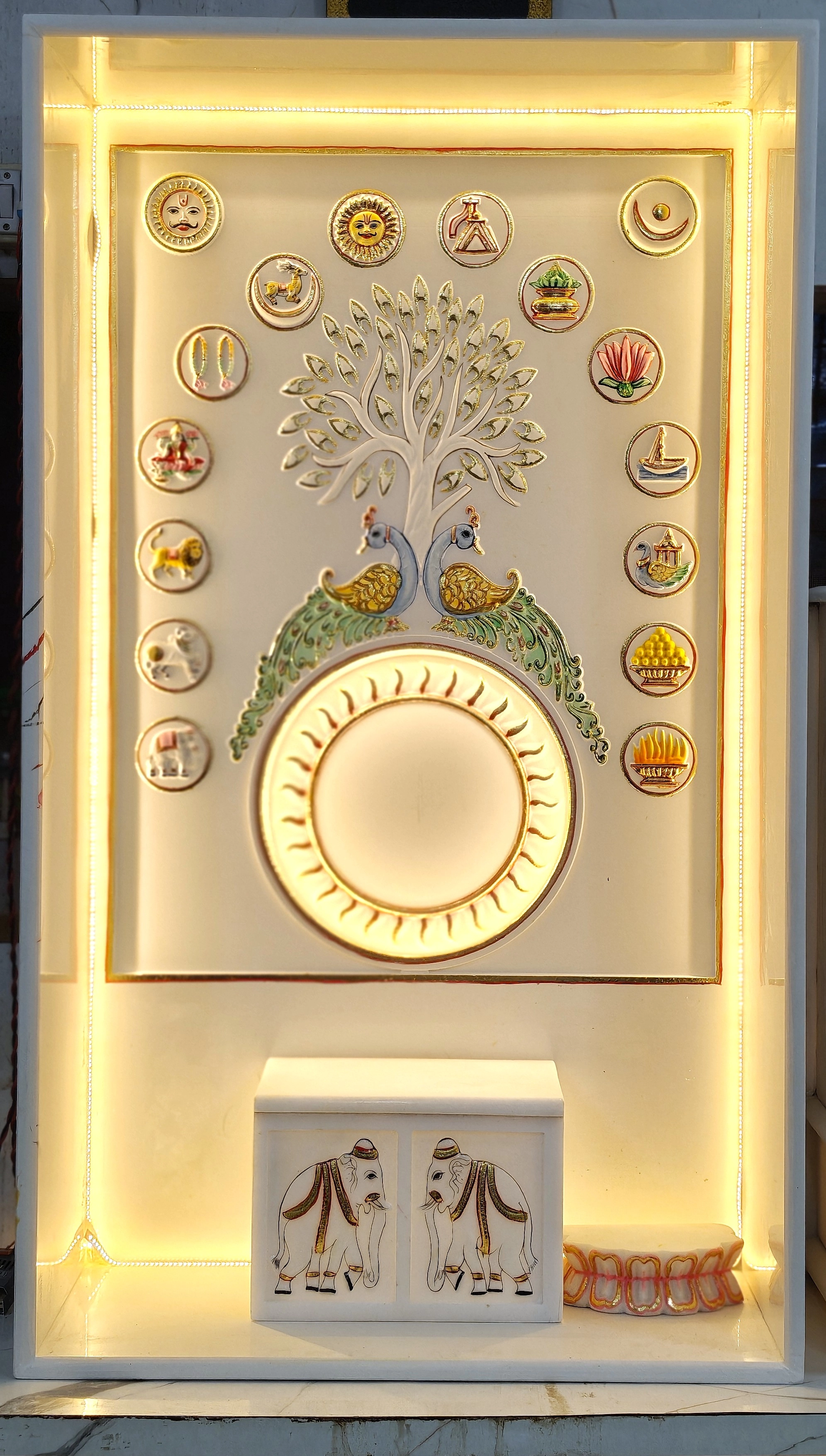 Pristine white marble mandir with Ashmangal and mor carvings