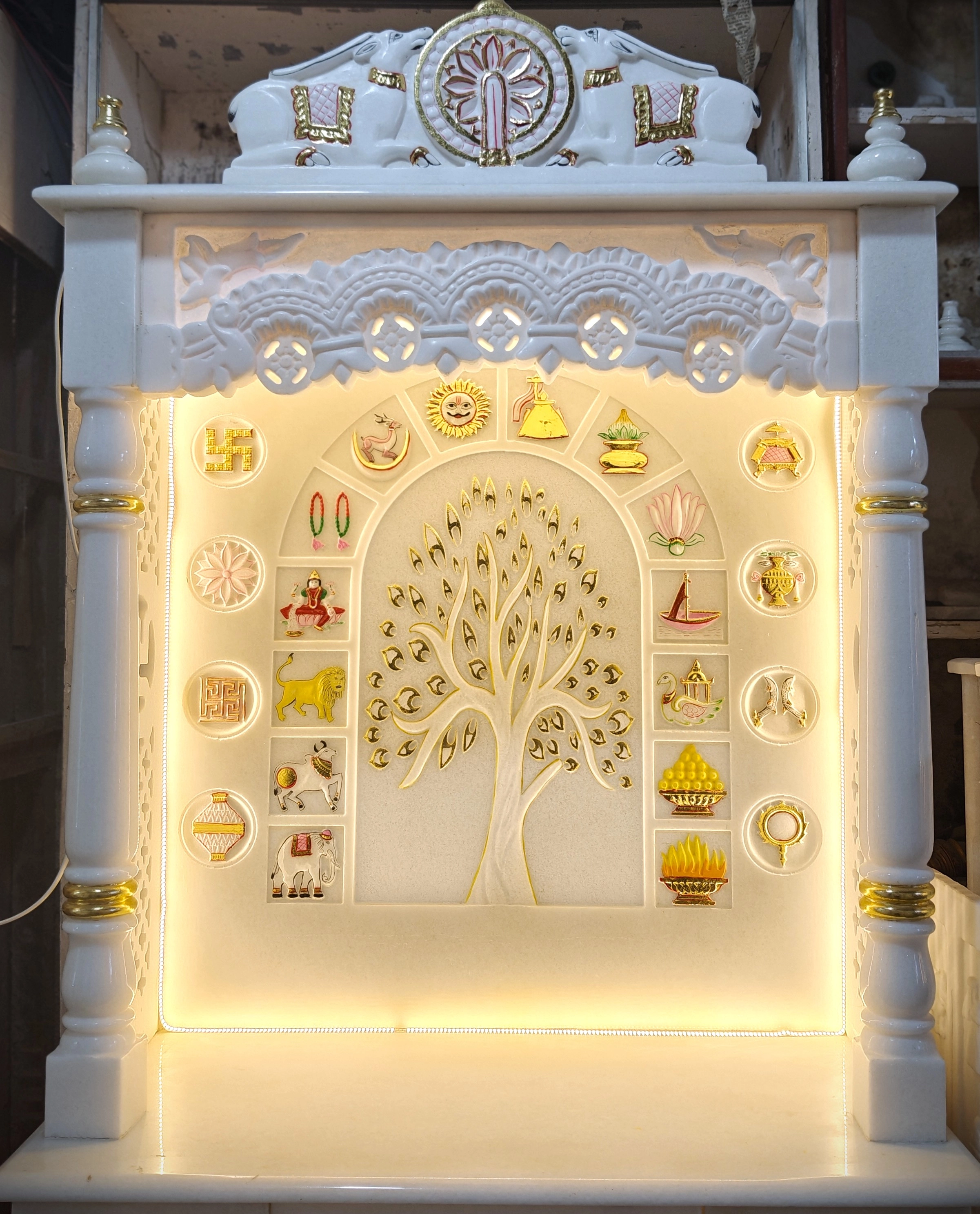 Elegant white marble mandir with intricate Jain carvings