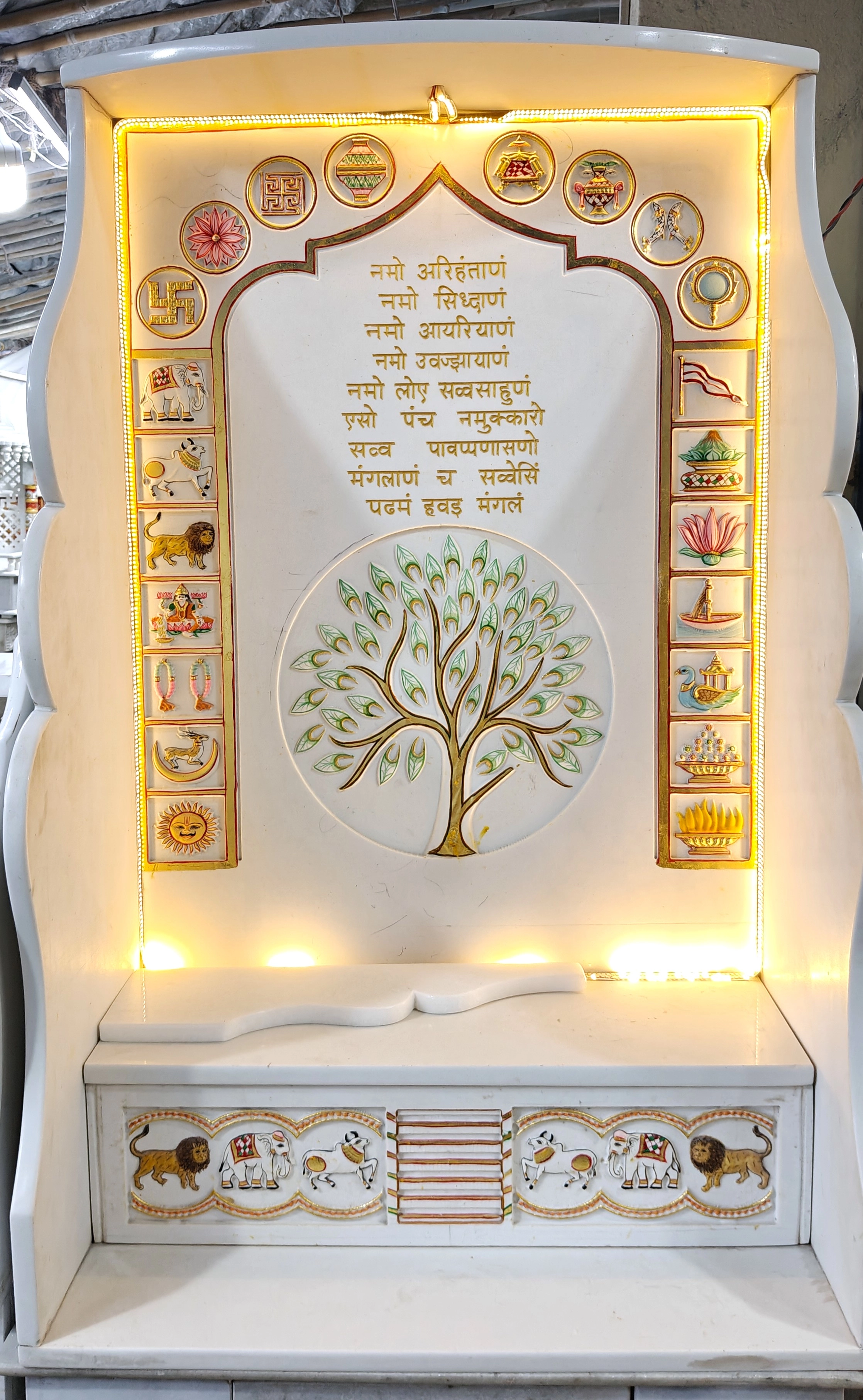 Elegant white marble mandir with intricate Jain carvings