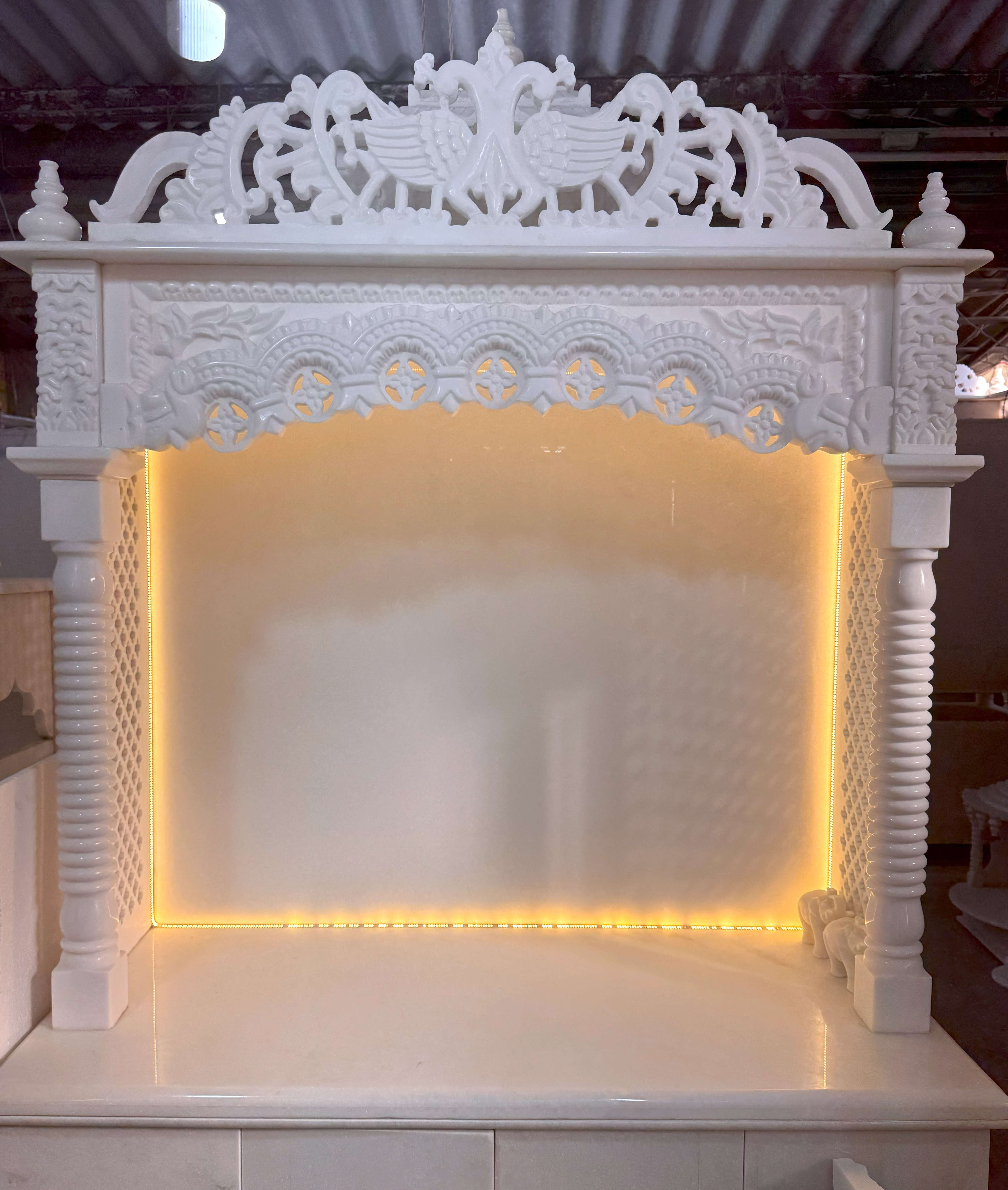 Pure white mandir with minimal design, 